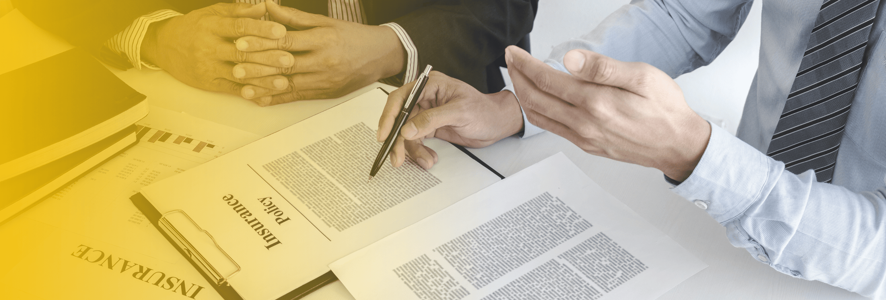 Insurance policy paperwork and financial consultation