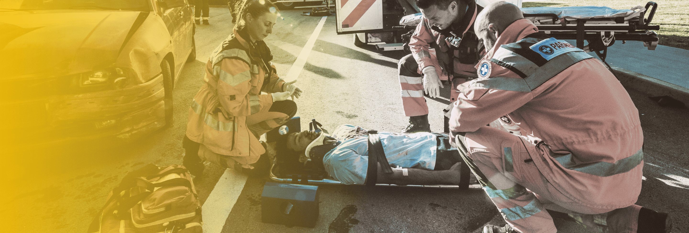 Emergency medics helping crash victim