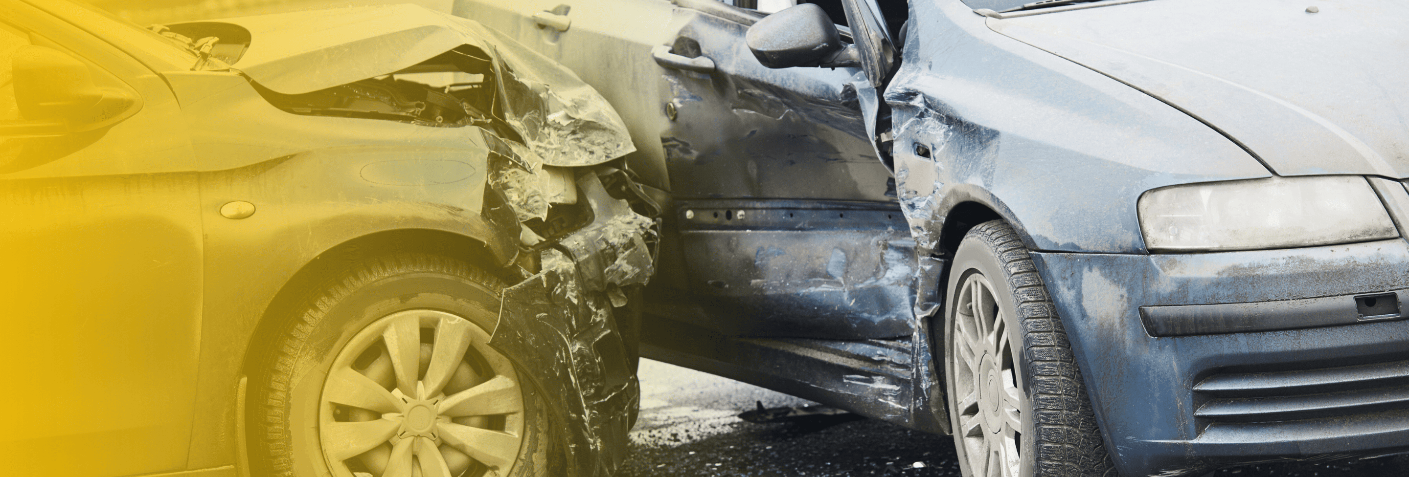 Close-up of severe damage to side of blue car from t-bone car crash